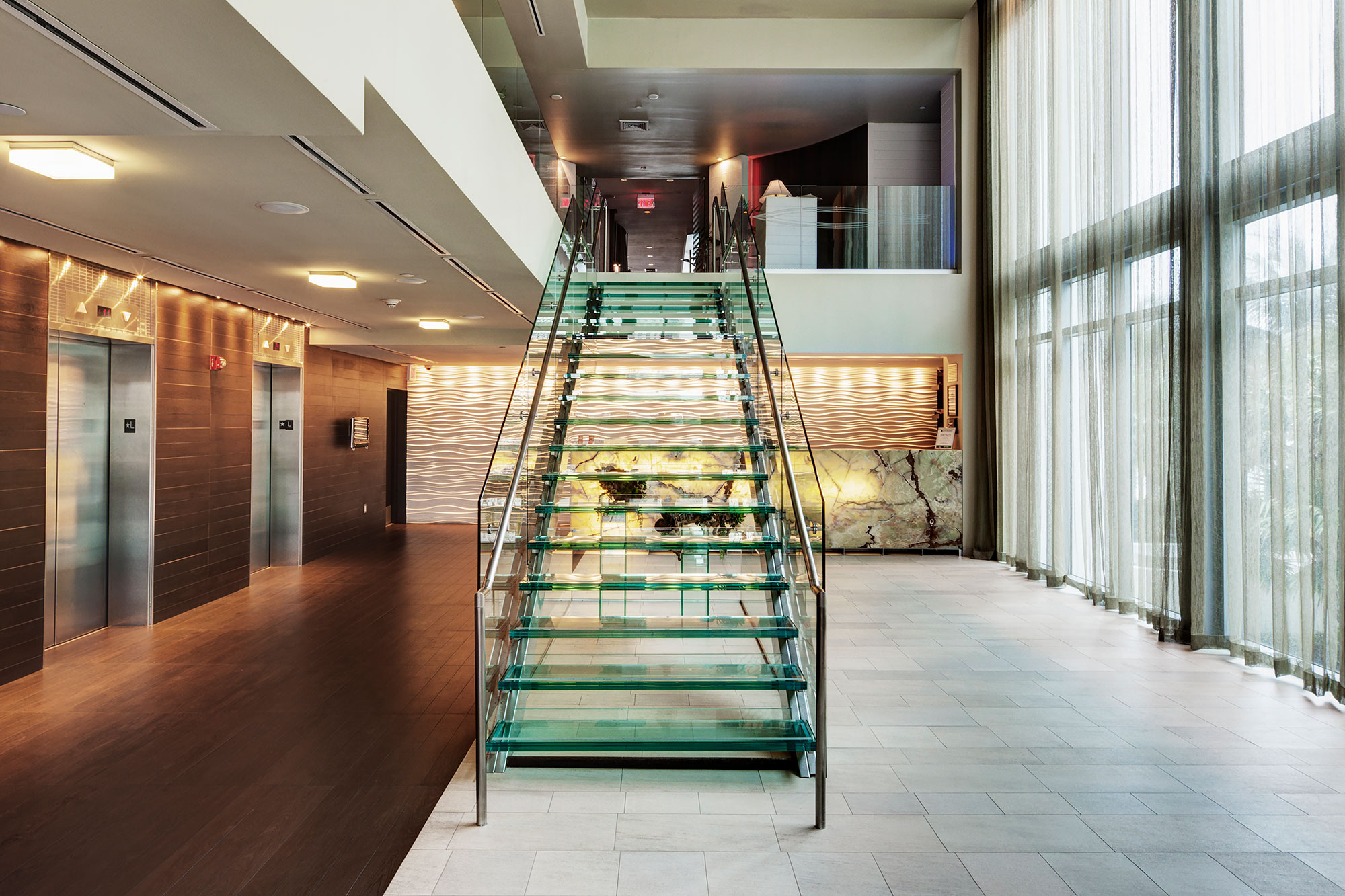 glass-staircase-in-hotel-lobby